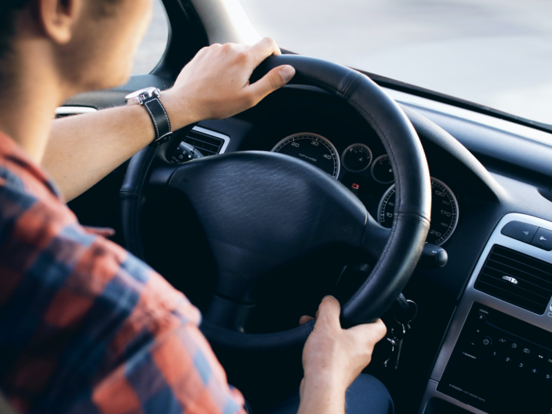 auto-loans-hero Man driving car